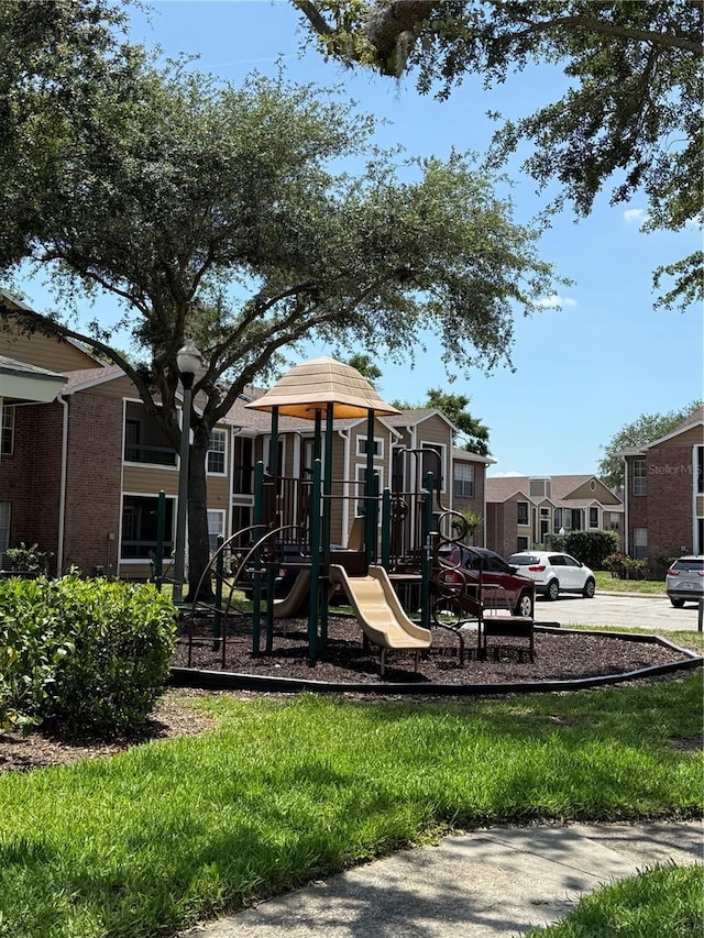 5540 Devonbriar Way Unit 103, Orlando, FL 32822 - community jungle gym featuring a residential view