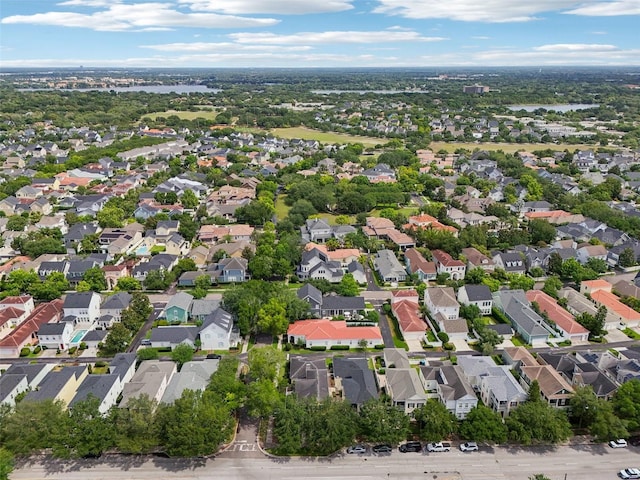 aerial view of property and surrounding area featuring nearby suburban area