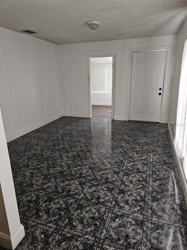 4061 Kirkland Blvd, Orlando, FL 32811 - unfurnished room with a textured ceiling