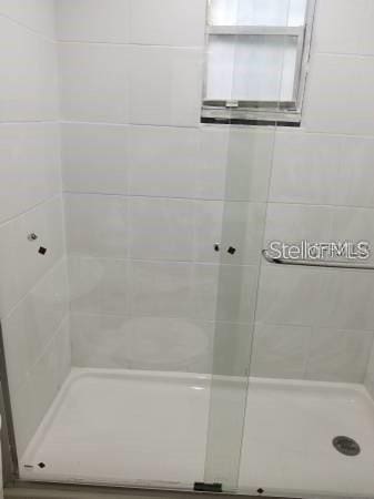 4061 Kirkland Blvd, Orlando, FL 32811 - full bathroom featuring a shower stall