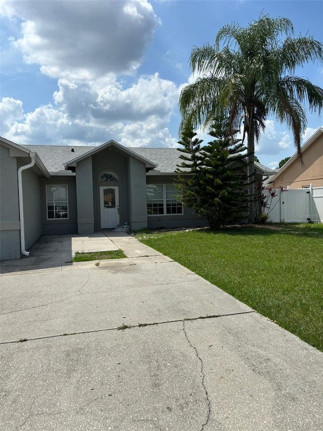 233 Red Maple Dr, Kissimmee, FL 34743 - single story home featuring stucco siding and a shingled roof