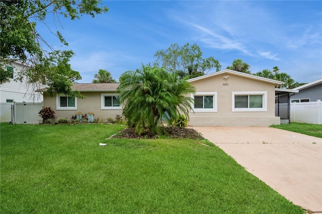 4651 Helena St NE, Saint Petersburg, FL 33703 - view of front of house with stucco siding and driveway