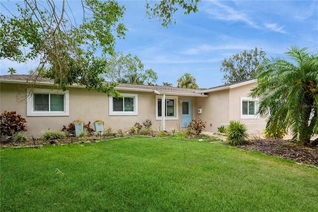 4651 Helena St NE, Saint Petersburg, FL 33703 - single story home with stucco siding and a front yard