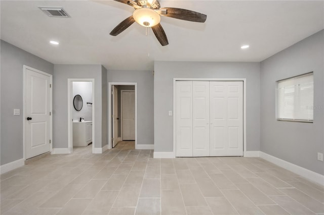 4651 Helena St NE, Saint Petersburg, FL 33703 - unfurnished bedroom featuring baseboards, recessed lighting, a closet, ceiling fan, and light tile patterned flooring