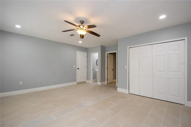 4651 Helena St NE, Saint Petersburg, FL 33703 - unfurnished bedroom featuring baseboards, recessed lighting, a ceiling fan, and a closet