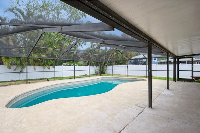 4651 Helena St NE, Saint Petersburg, FL 33703 - view of swimming pool featuring a fenced backyard, a patio area, and glass enclosure