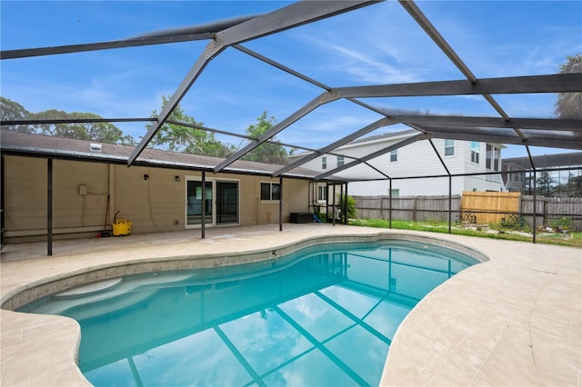 4651 Helena St NE, Saint Petersburg, FL 33703 - view of swimming pool featuring a patio, fence, and glass enclosure