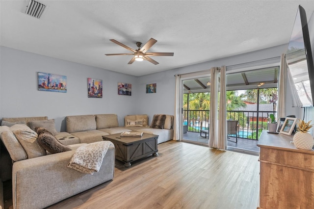 758 E Michigan St Unit 208, Orlando, FL 32806 - living room featuring ceiling fan and light wood finished floors