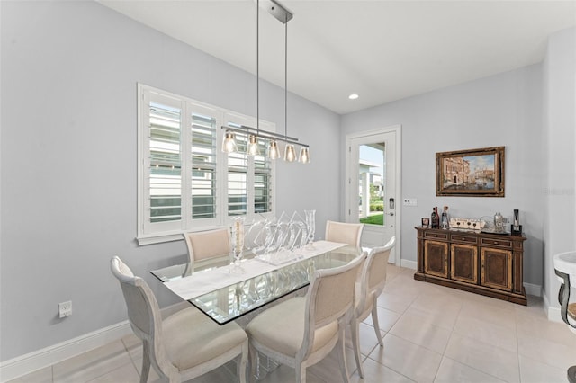 dining room featuring light tile patterned floors, baseboards, and recessed lighting