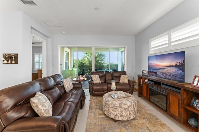 living area with light tile patterned flooring