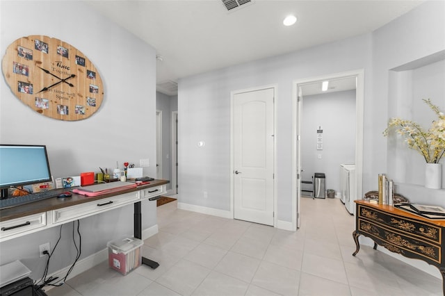 home office with light tile patterned floors and baseboards