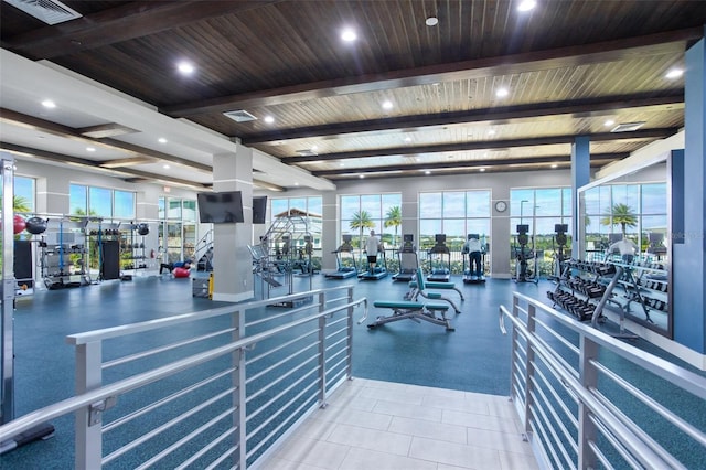 exercise room with beamed ceiling, recessed lighting, and wooden ceiling