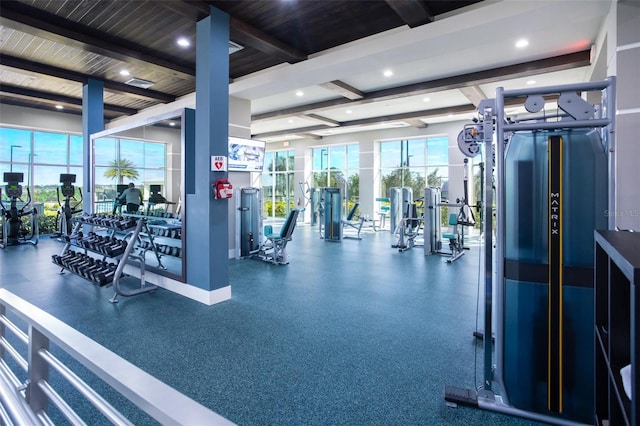 gym with beamed ceiling, recessed lighting, and baseboards