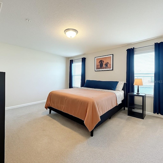 1045 Desert Candle Dr, Ocoee, FL 34761 - bedroom with light colored carpet, baseboards, and a textured ceiling