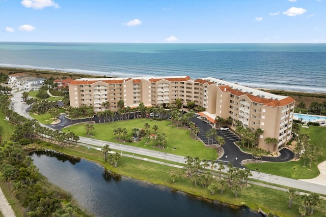 aerial view of apartment complex and a large body of water