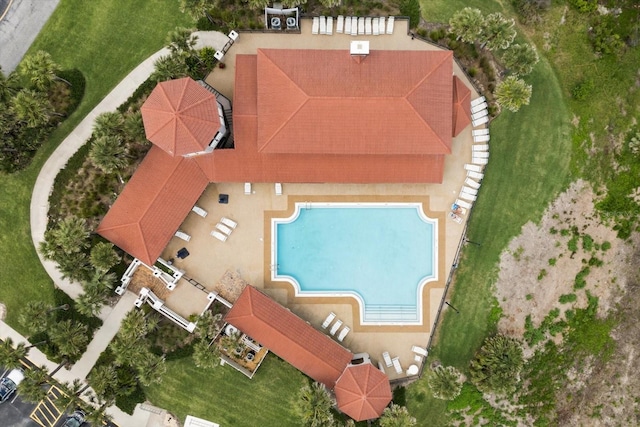 aerial view of property and surrounding area with a pool area