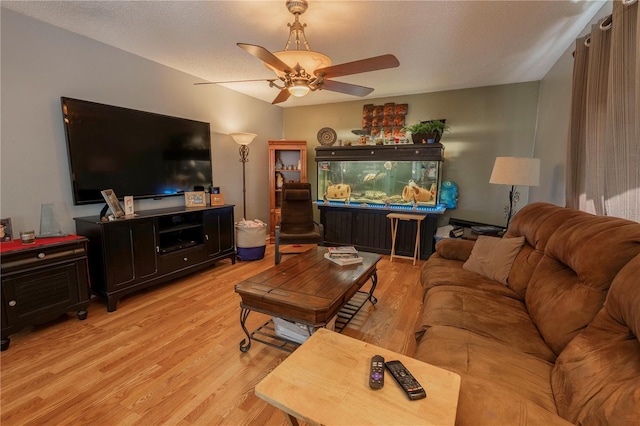 3216 White Blossom Ln, Clermont, FL 34711 - living area featuring light wood-style flooring and ceiling fan