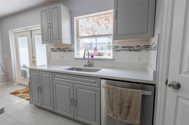 3216 White Blossom Ln, Clermont, FL 34711 - kitchen featuring dishwasher, gray cabinetry, backsplash, and plenty of natural light