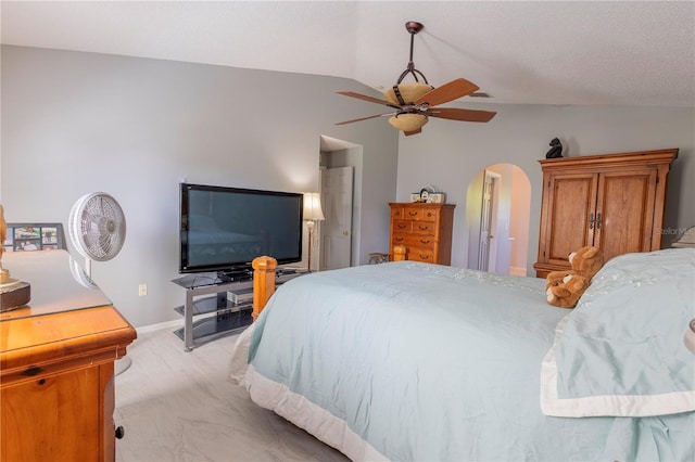 3216 White Blossom Ln, Clermont, FL 34711 - bedroom featuring vaulted ceiling, arched walkways, light colored carpet, and ceiling fan