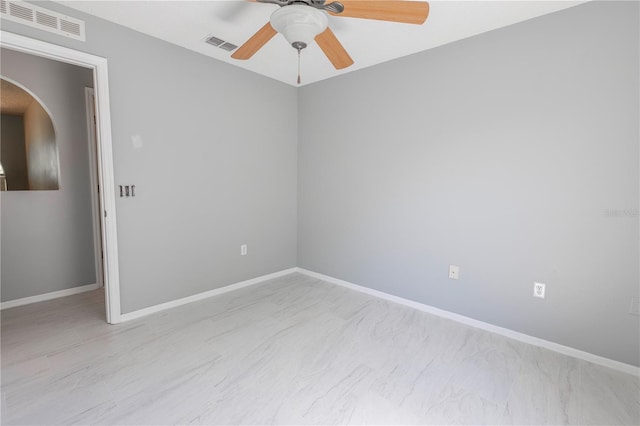 3216 White Blossom Ln, Clermont, FL 34711 - empty room featuring arched walkways and a ceiling fan