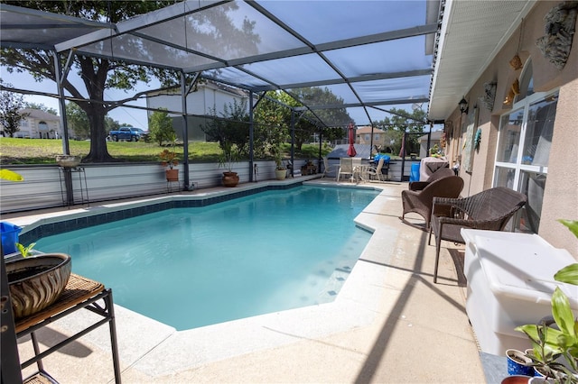 3216 White Blossom Ln, Clermont, FL 34711 - outdoor pool featuring a patio and glass enclosure
