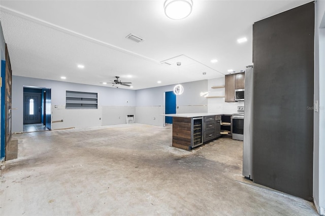 2302 16th St W, Palmetto, FL 34221 - kitchen featuring unfinished concrete floors, beverage cooler, stainless steel appliances, open shelves, and recessed lighting