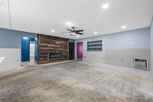 2302 16th St W, Palmetto, FL 34221 - unfurnished living room with ceiling fan, a large fireplace, and recessed lighting