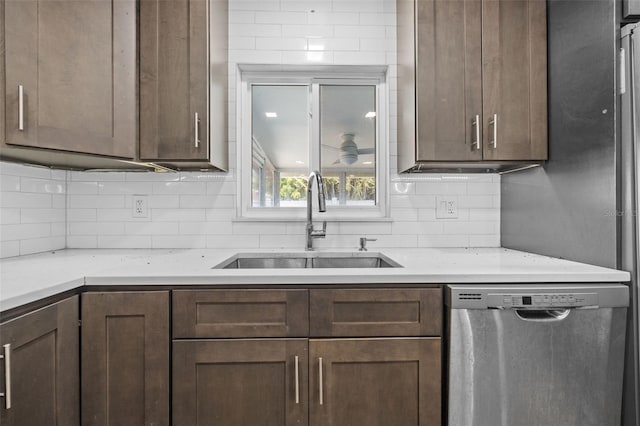 2302 16th St W, Palmetto, FL 34221 - kitchen featuring stainless steel dishwasher, light countertops, backsplash, and dark brown cabinetry