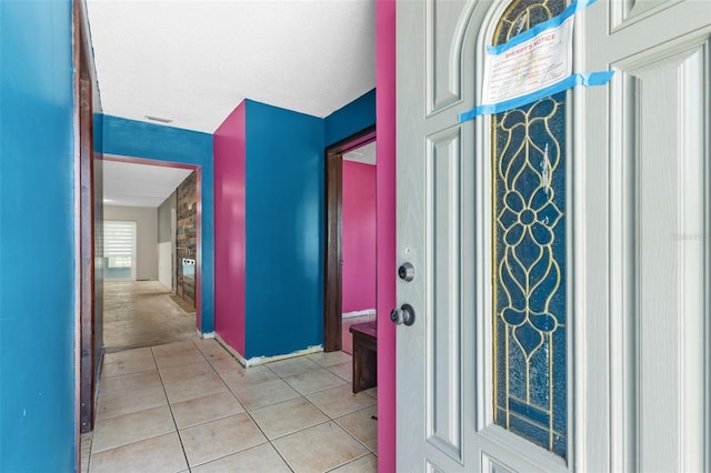 2302 16th St W, Palmetto, FL 34221 - foyer featuring light tile patterned floors and baseboards