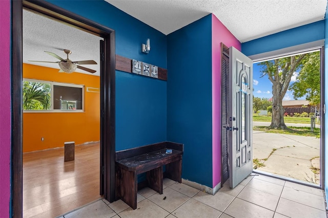 2302 16th St W, Palmetto, FL 34221 - entrance foyer featuring a textured ceiling, healthy amount of natural light, a ceiling fan, and tile patterned floors