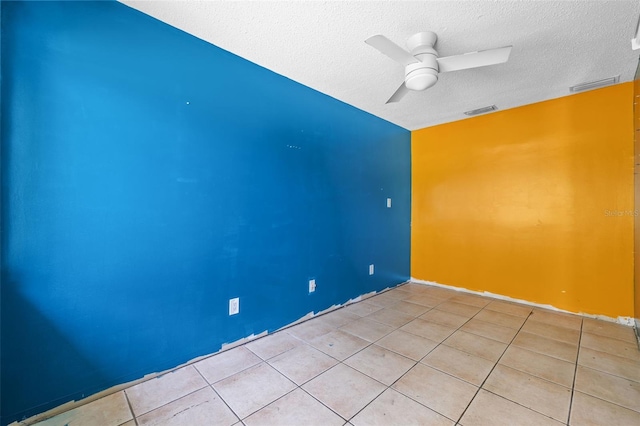 2302 16th St W, Palmetto, FL 34221 - empty room with a textured ceiling, light tile patterned floors, and a ceiling fan