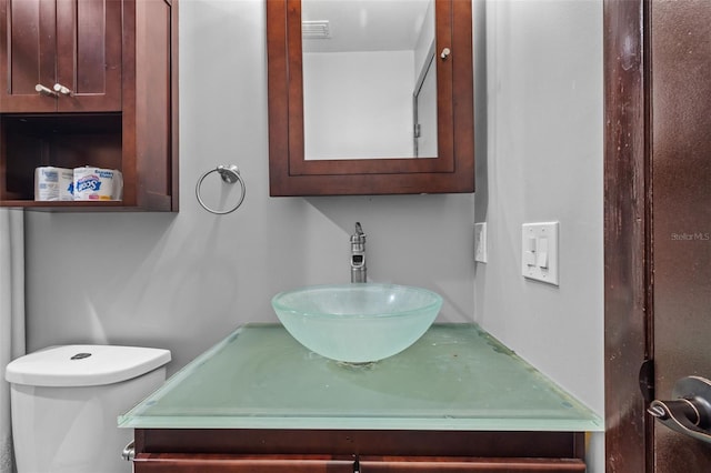 2302 16th St W, Palmetto, FL 34221 - bathroom with toilet and vanity