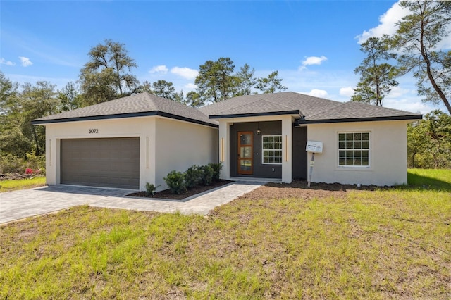 3072 SW 168th Loop, Ocala, FL 34473 - view of front facade featuring an attached garage, stucco siding, a front yard, and driveway
