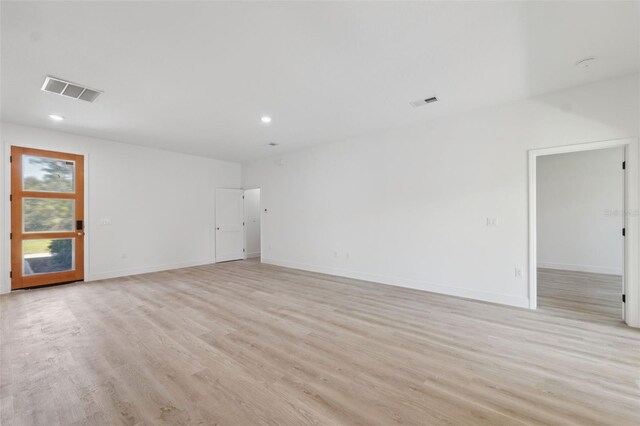 3072 SW 168th Loop, Ocala, FL 34473 - empty room with light wood-style floors, recessed lighting, and baseboards