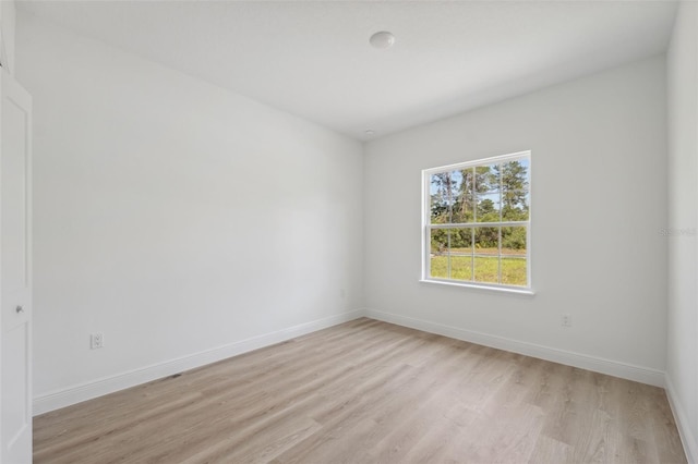 3072 SW 168th Loop, Ocala, FL 34473 - unfurnished room featuring light wood finished floors and baseboards