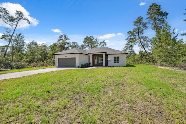 3072 SW 168th Loop, Ocala, FL 34473 - view of front facade with driveway, a garage, stucco siding, and a front lawn