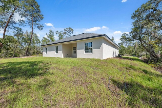 3072 SW 168th Loop, Ocala, FL 34473 - rear view of property featuring stucco siding
