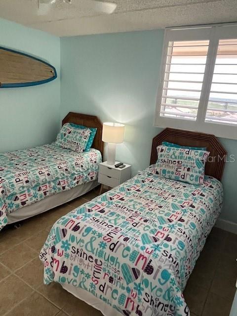 4453 S Atlantic Ave Unit 602, Ponce Inlet, FL 32127 - bedroom featuring tile patterned floors and ceiling fan
