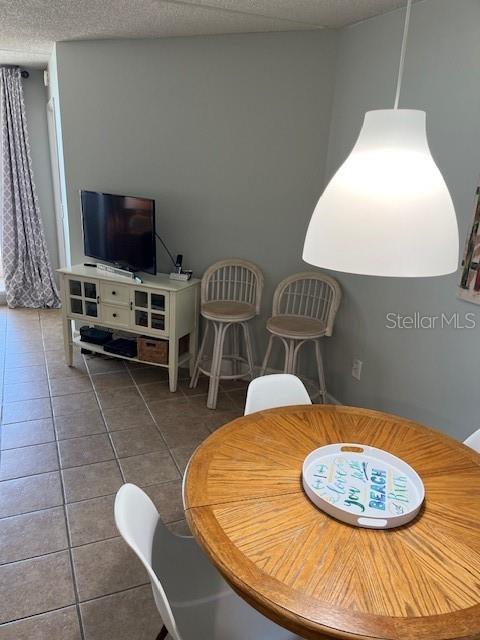 4453 S Atlantic Ave Unit 602, Ponce Inlet, FL 32127 - dining space featuring tile patterned floors