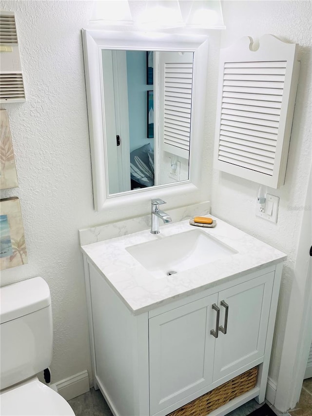 4453 S Atlantic Ave Unit 602, Ponce Inlet, FL 32127 - half bath with vanity, toilet, and a textured wall