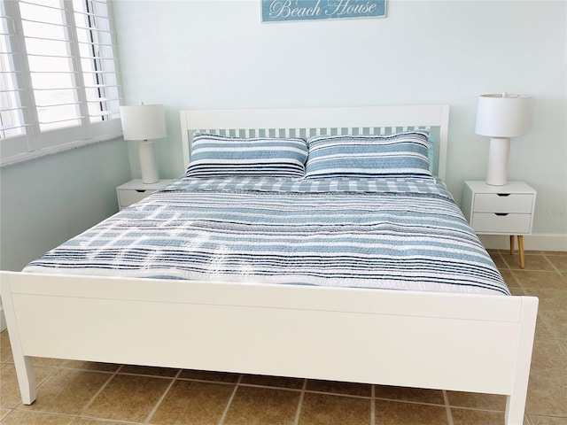 4453 S Atlantic Ave Unit 602, Ponce Inlet, FL 32127 - bedroom featuring tile patterned floors
