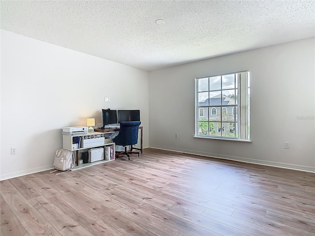 2384 Andrews Valley Dr, Kissimmee, FL 34758 - office with a textured ceiling, wood finished floors, and baseboards