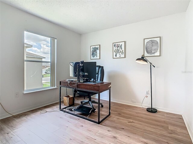 2384 Andrews Valley Dr, Kissimmee, FL 34758 - home office with wood finished floors and baseboards