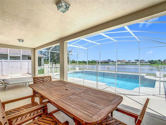 2384 Andrews Valley Dr, Kissimmee, FL 34758 - swimming pool with a patio area, a water view, and glass enclosure