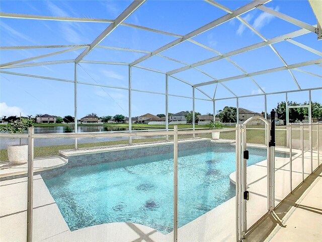2384 Andrews Valley Dr, Kissimmee, FL 34758 - outdoor pool featuring glass enclosure and a water view