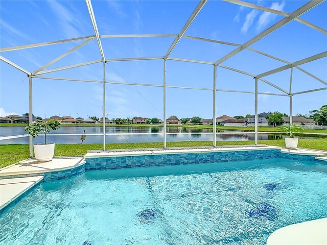 2384 Andrews Valley Dr, Kissimmee, FL 34758 - swimming pool with a water view, glass enclosure, a residential view, and a patio