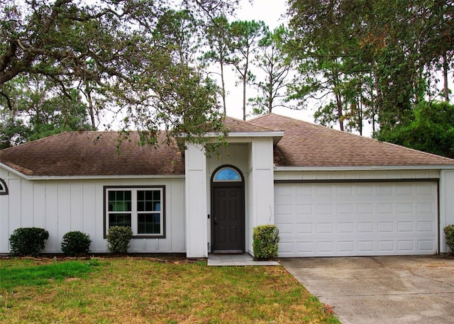 548 Glen Haven Dr, Deltona, FL 32738 - single story home featuring roof with shingles, driveway, an attached garage, a front yard, and board and batten siding
