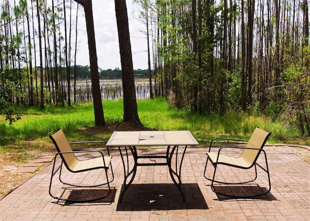 548 Glen Haven Dr, Deltona, FL 32738 - view of patio / terrace featuring a water view and outdoor dining area