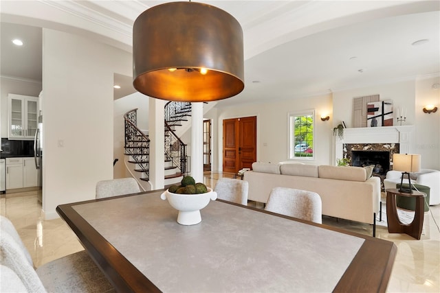 1010 Terrace Blvd, Orlando, FL 32803 - dining space featuring ornamental molding, stairway, a high end fireplace, recessed lighting, and light marble finish flooring