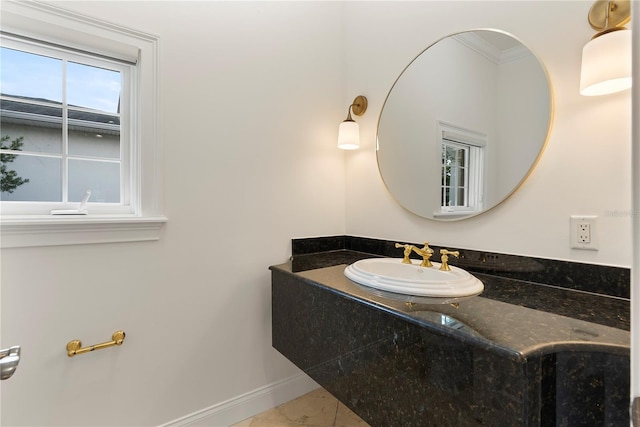 1010 Terrace Blvd, Orlando, FL 32803 - bathroom featuring baseboards, vanity, crown molding, and tile patterned floors